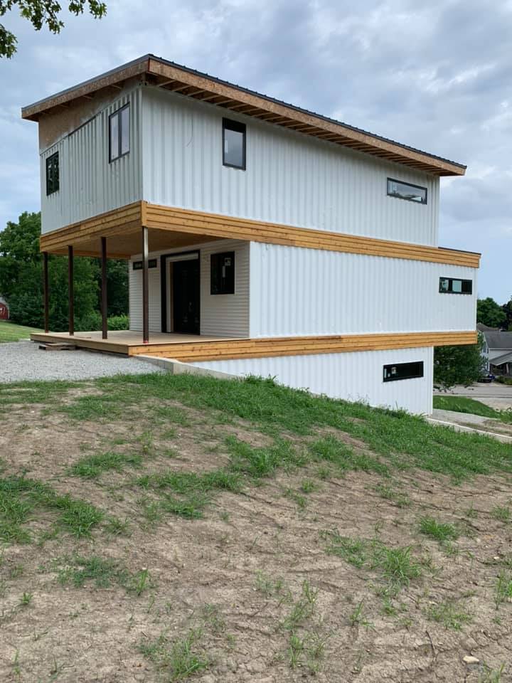 white exterior shipping container home 