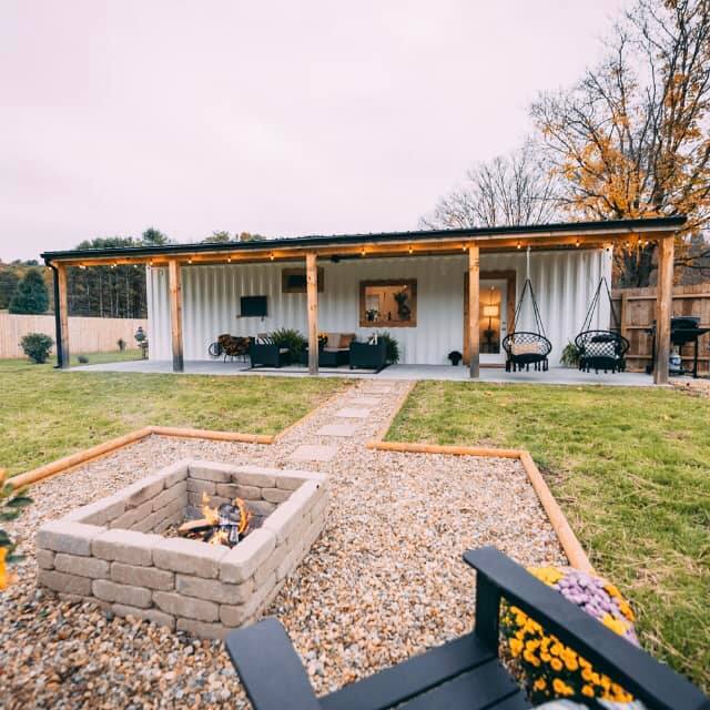 Shipping container hub home in Alaska with porch