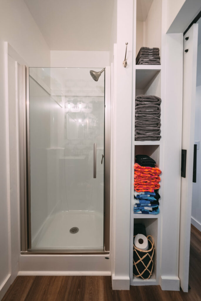 Step-in shower and towel storage