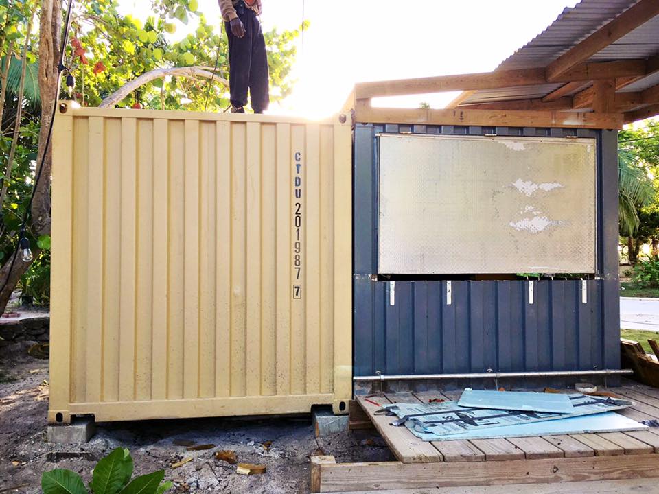 person standing over container cabin