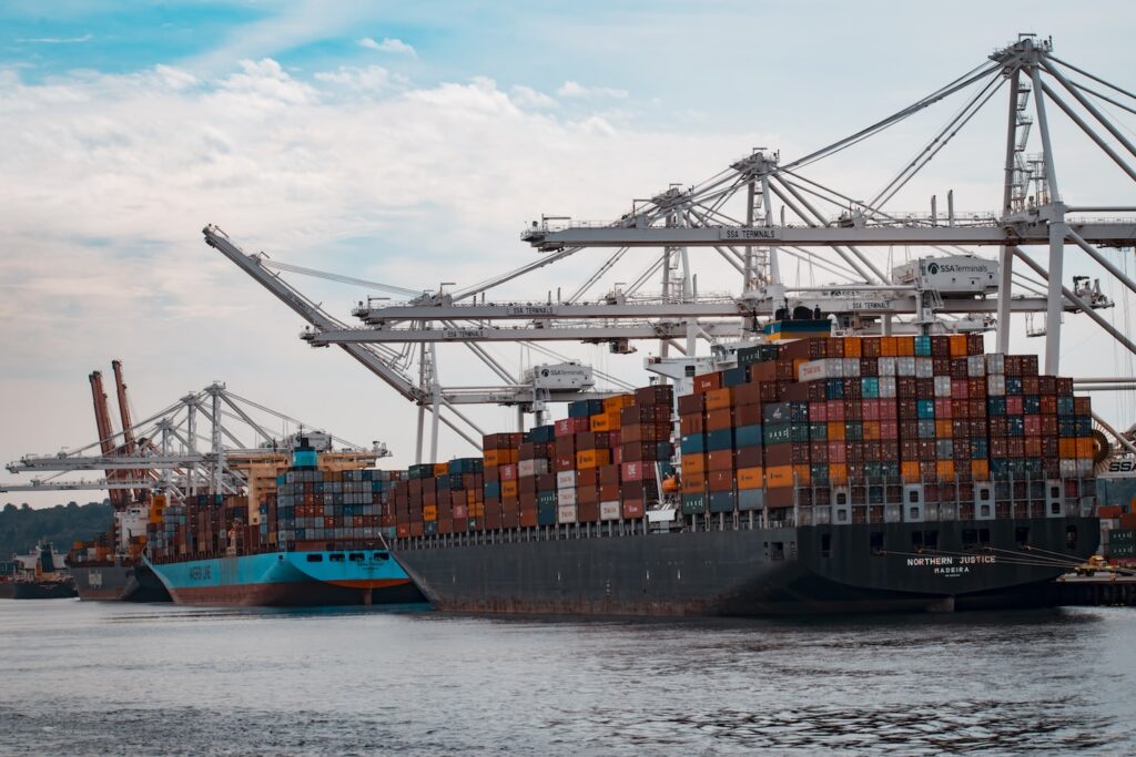 cargo ships docked at the pier during day
