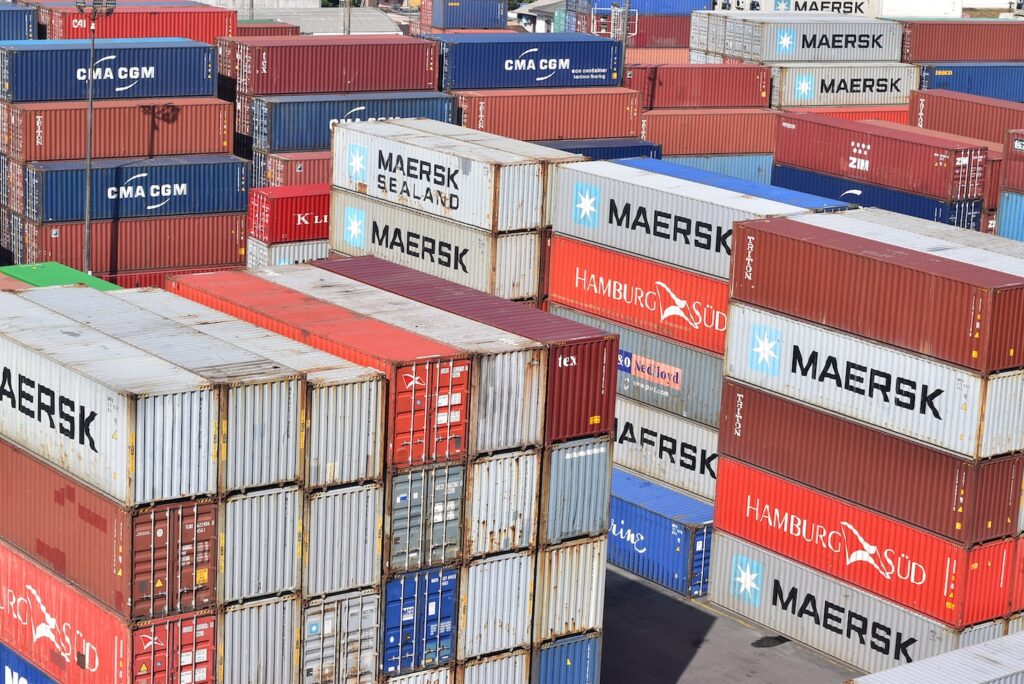 red blue and white intermodal containers
