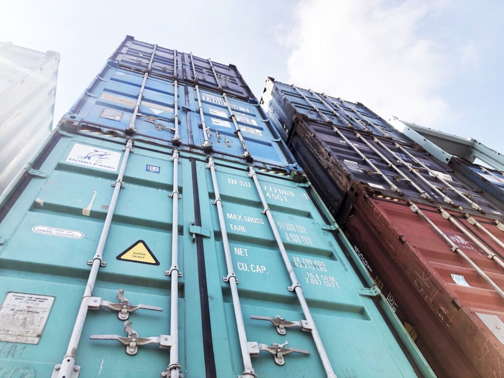 blue steel door under white clouds during daytime
