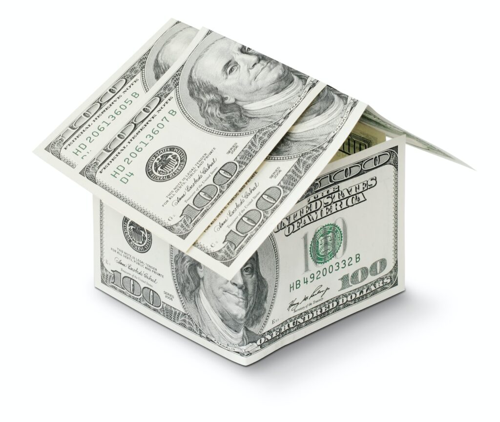 small house shape made with paper money